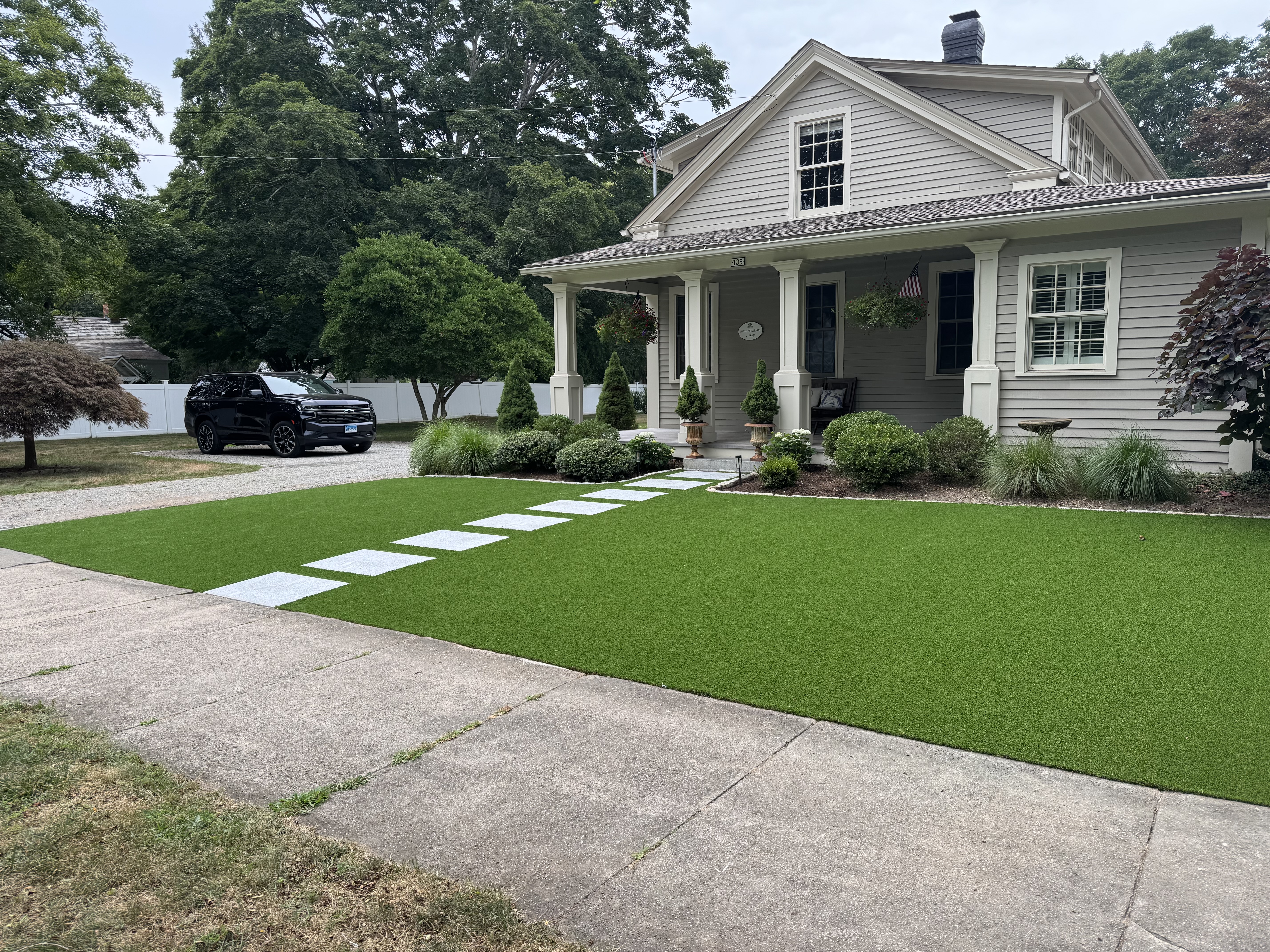 Craftsman home with synthetic lawn