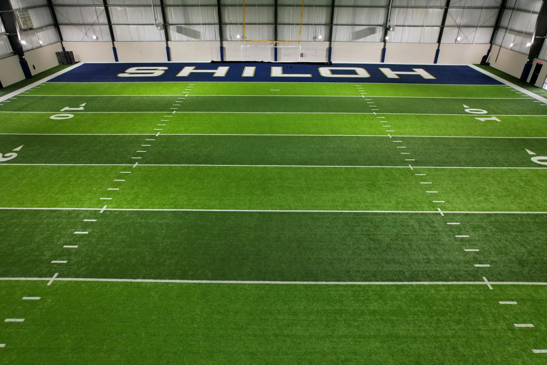 Indoor training field surfaced with PIVOT synthetic turf