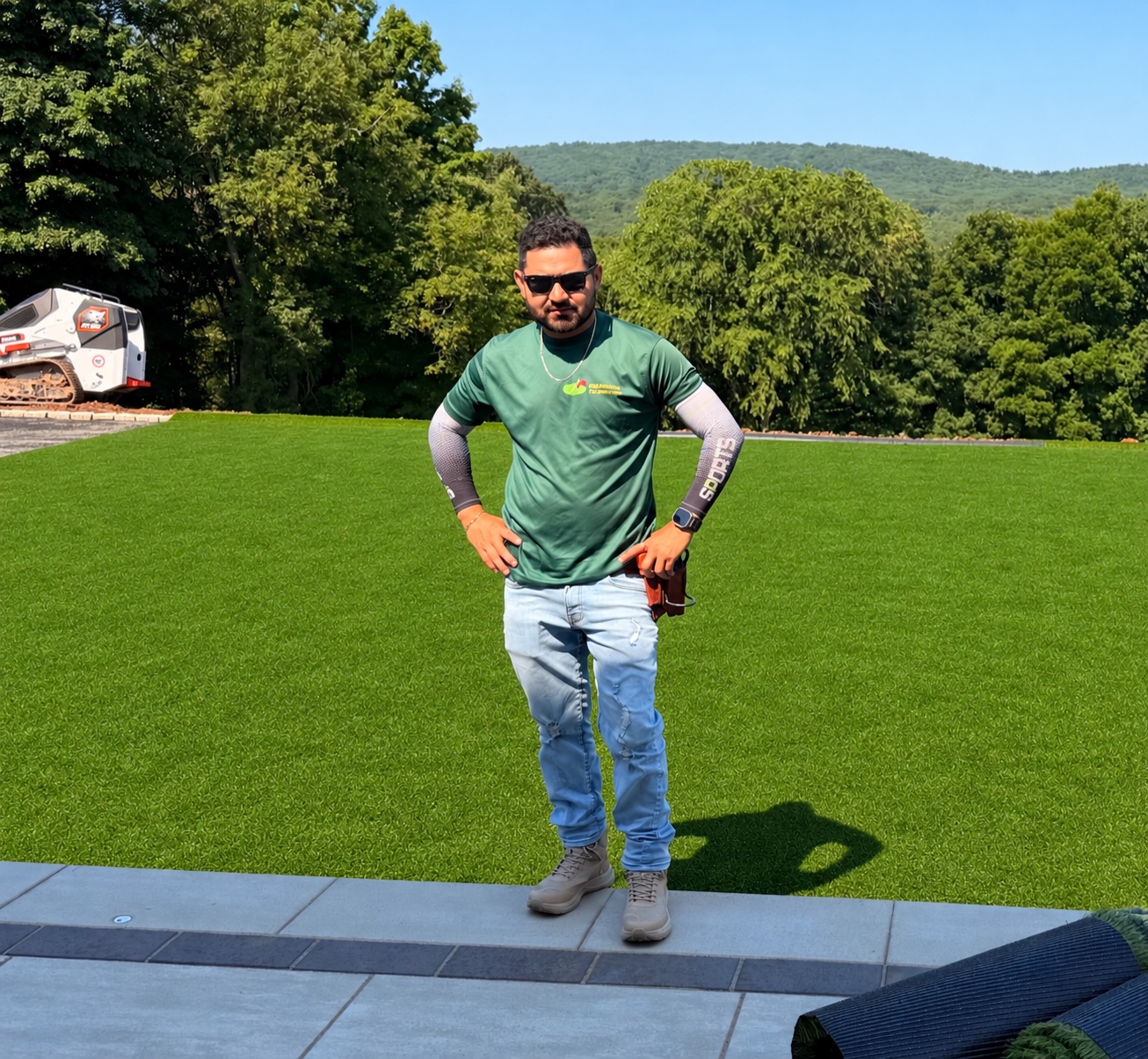 Elmer Herrera at a Performance Turf installation, wearing his Performance Turf shirt